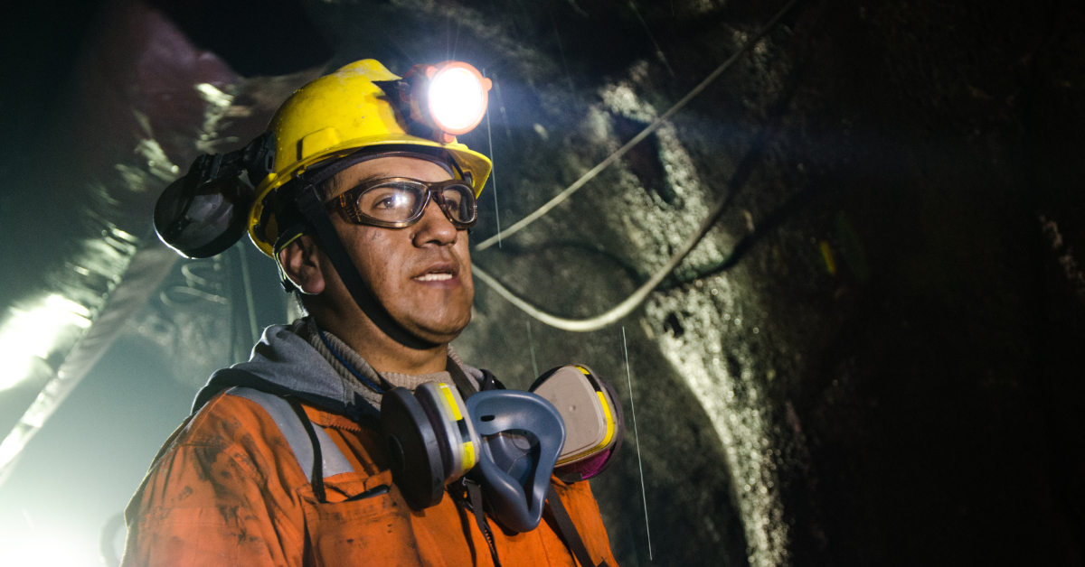 Miner working underground with safety equipment, representing the Standard 11 Underground Mining Induction course, with Down Under Training.