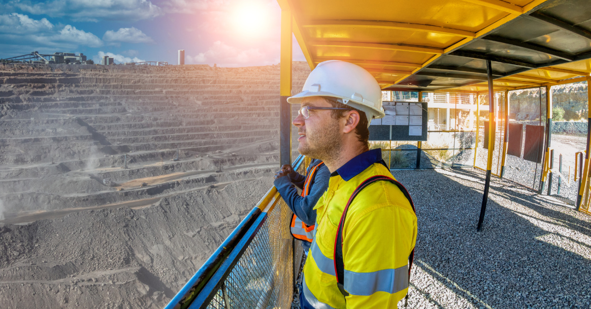 Representation of a Mining Supervisor overseeing operations in an open-pit mine – S123 Supervisor Training Course